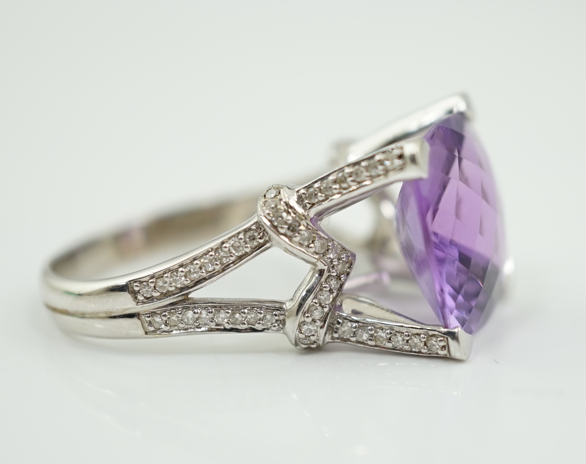 A modern 14k white gold and single stone fancy cushion cut amethyst dress ring